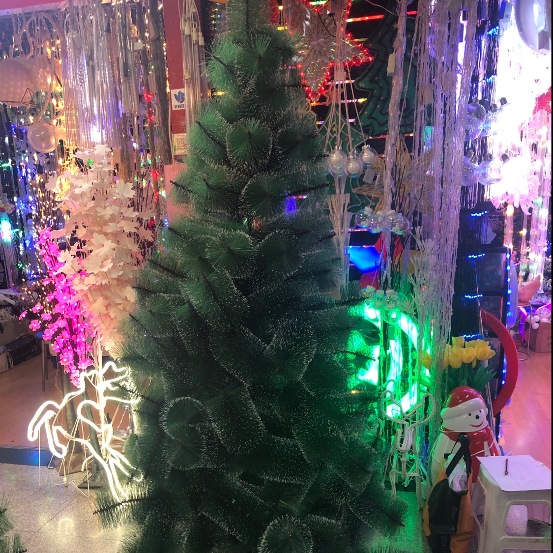 A huge white-edged Christmas tree