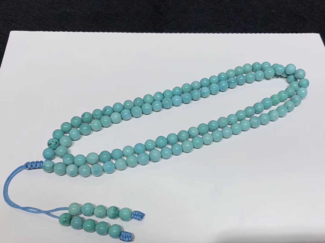 A 108-bead Buddhist prayer bead bracelet made of raw turquoise