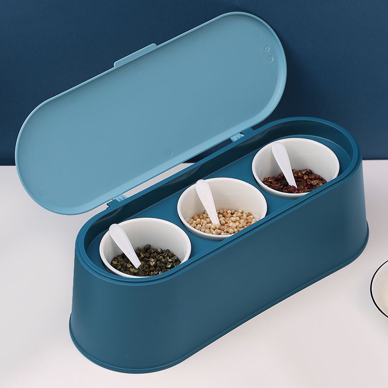 The Emino seasoning box and jar are dark blue