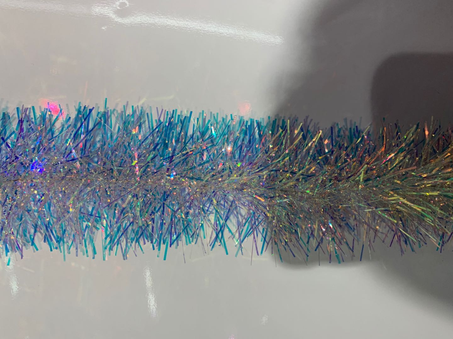 Crystal filaments with coloured stripes