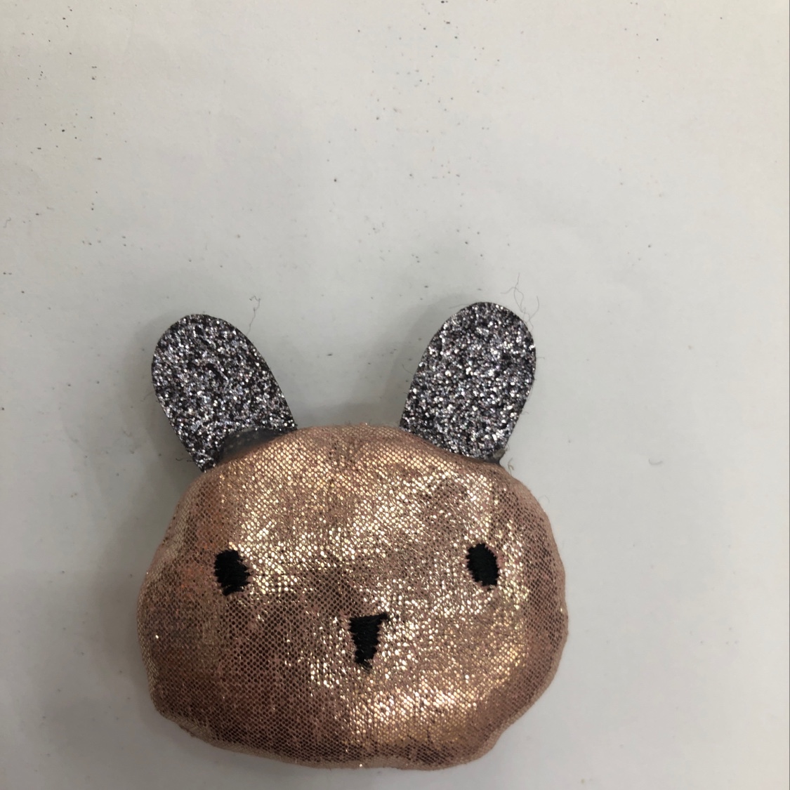 A cute little bear in shiny leather