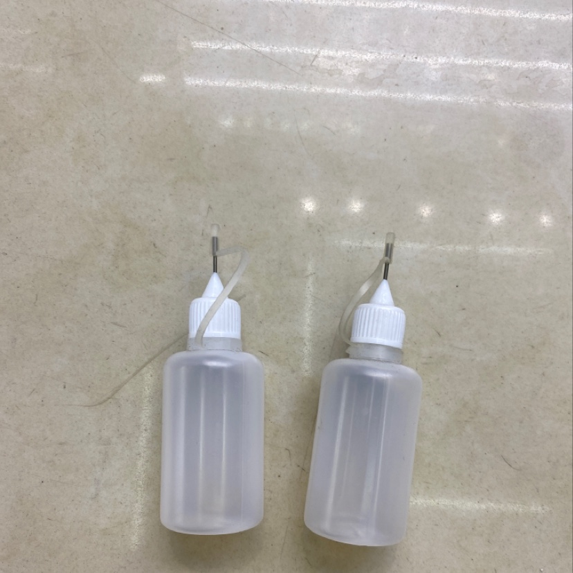 Dispensing bottle, dispensing tool,