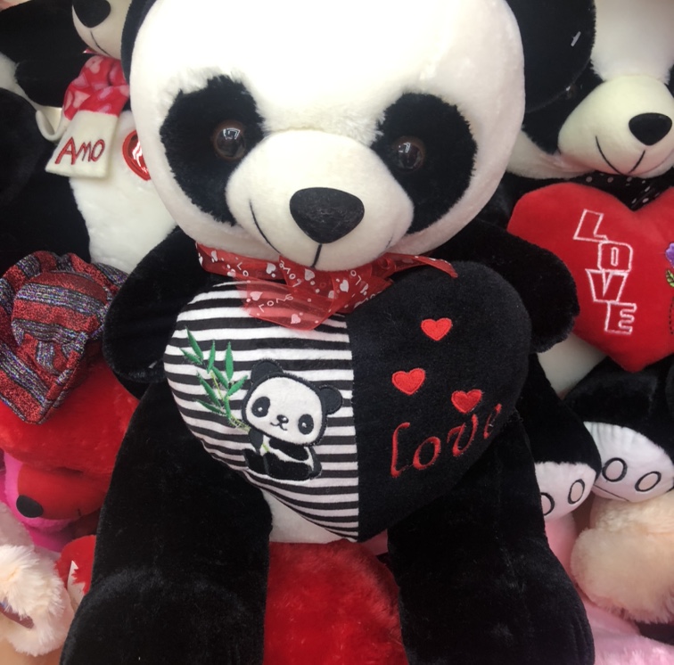 A 30cm panda hugging its heart with embroidered letters