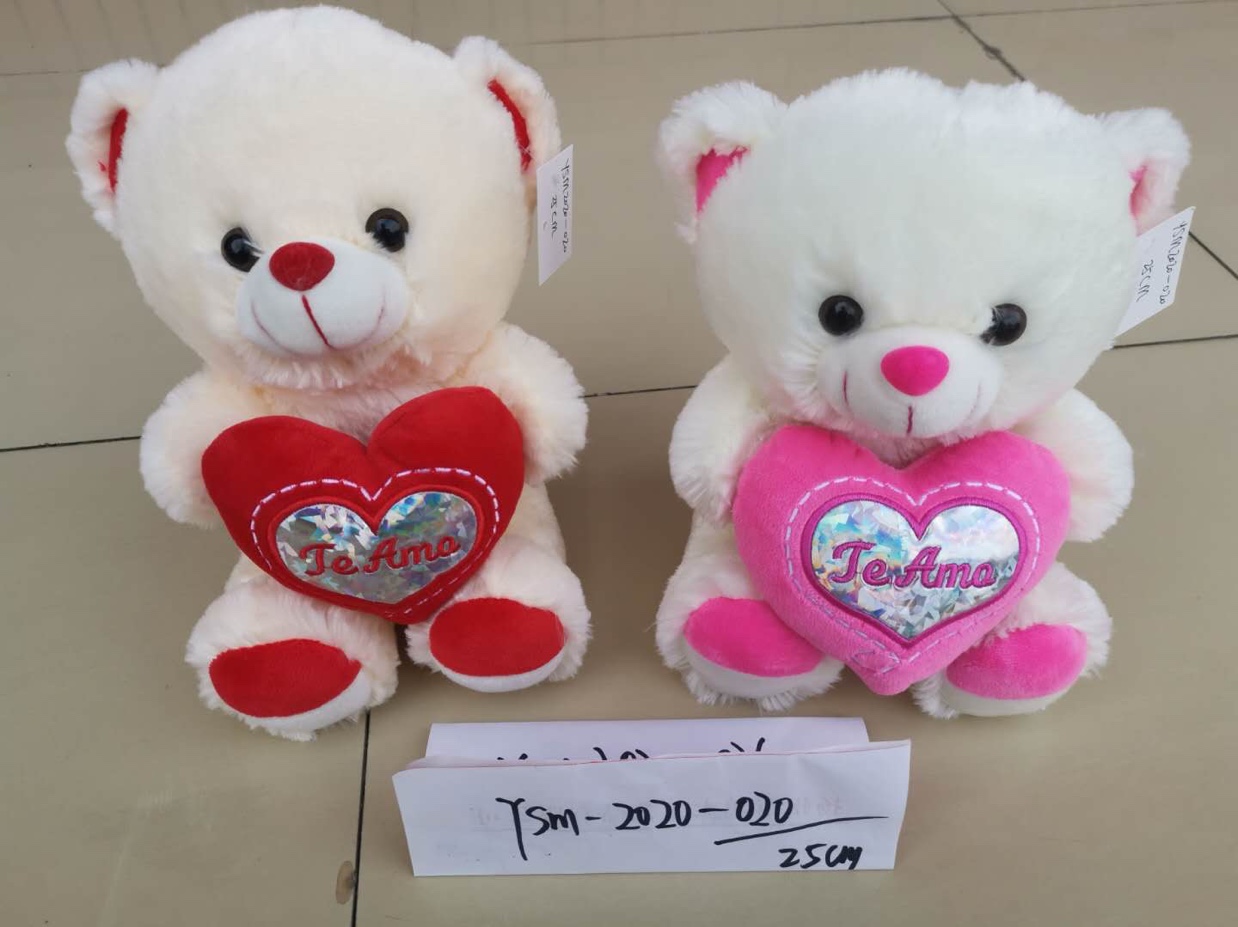 Cuddly bear gives little girls toys