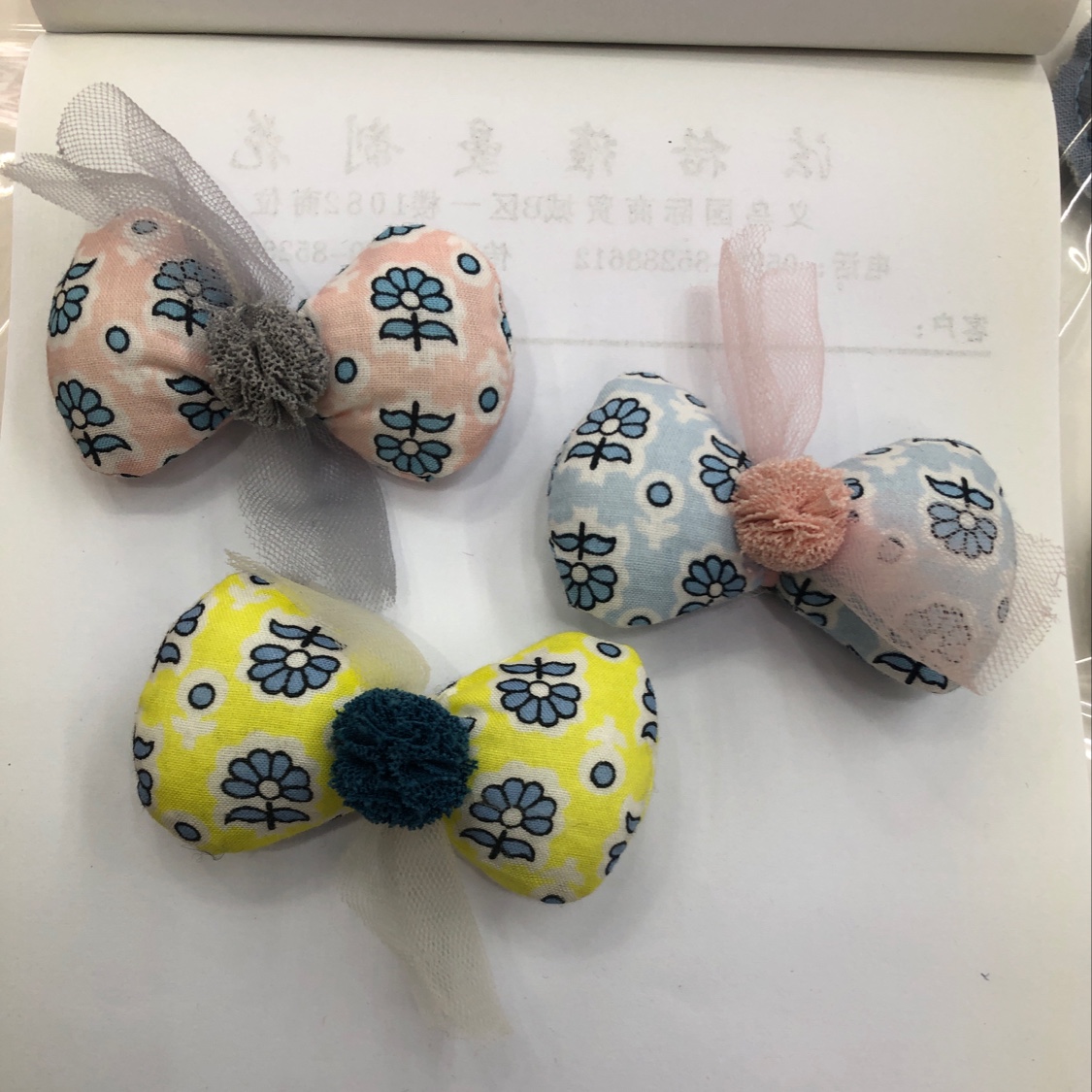 Floral fabric with cotton-padded bow ties and small balls