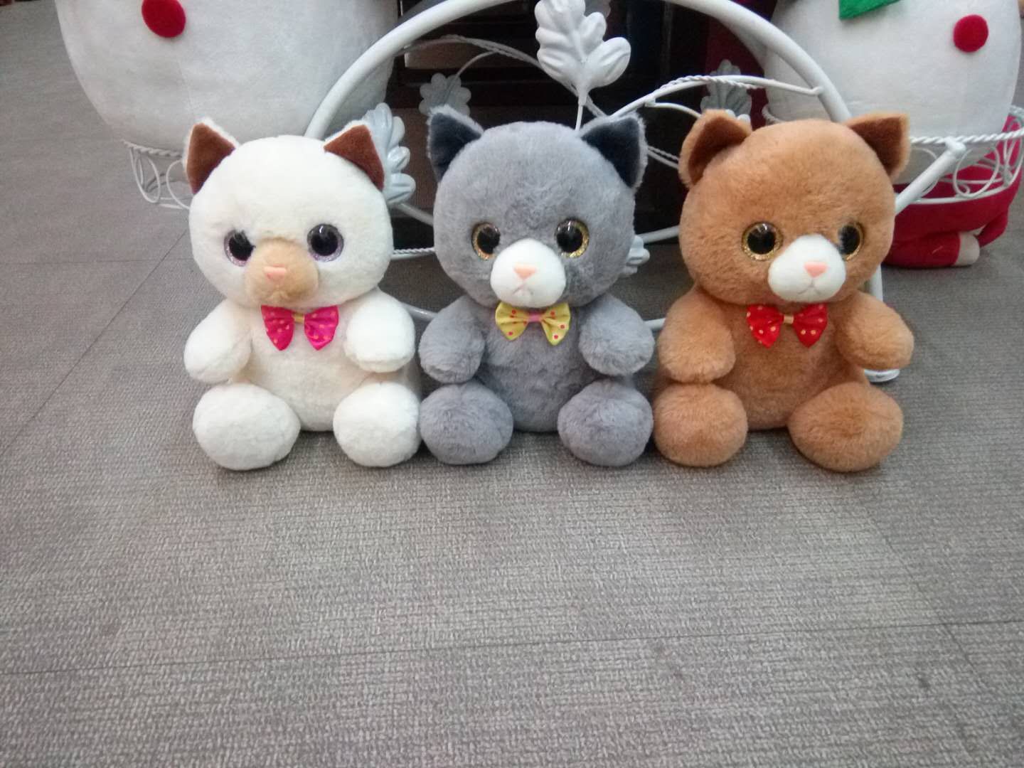 Bow-tied big-eyed cat stuffed animal thumbnail