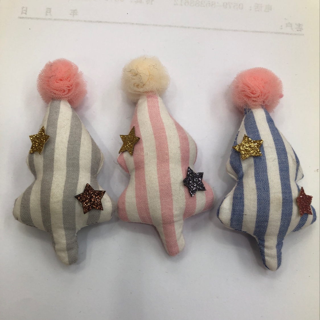 A striped fabric tree with small balls