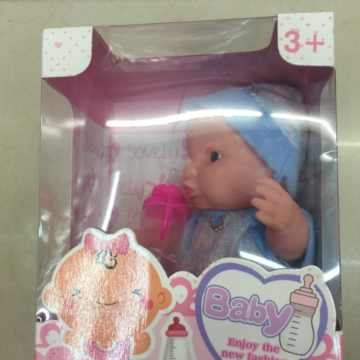 A baby bottle with a rubber box