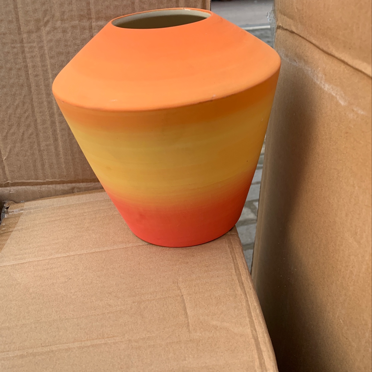 A small round-mouthed colorful vase