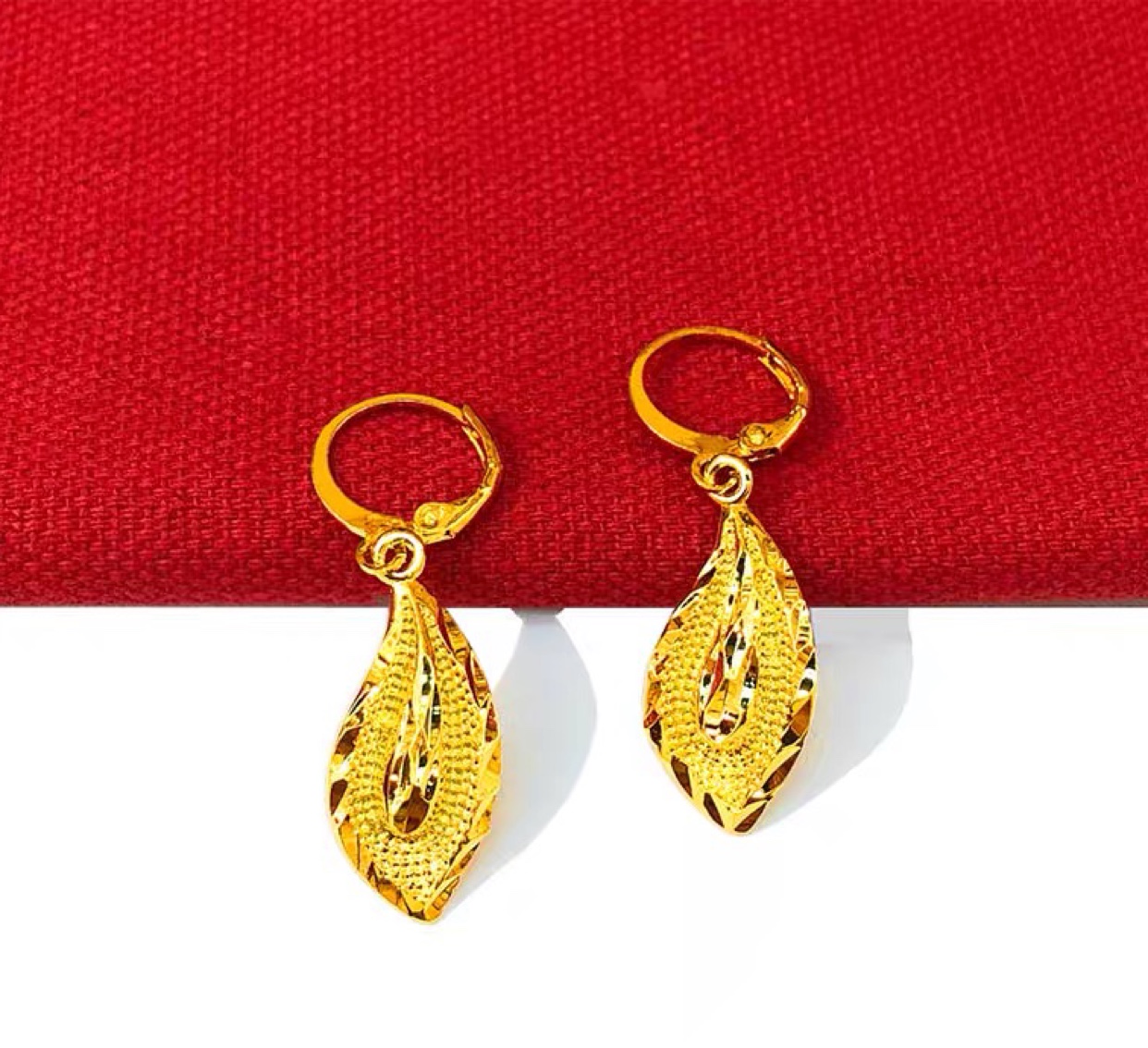 Golden earrings and female national color of ancient law heritage thumbnail
