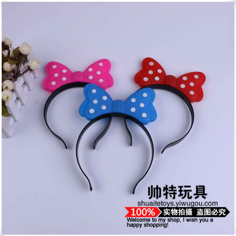 Colorful background with white dots and flashing light bow headband