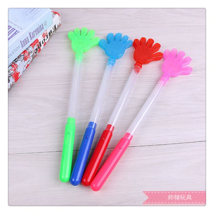 Clapping hands with flashing sticks to support the bar, listening to music to add to the fun, and lighting toys