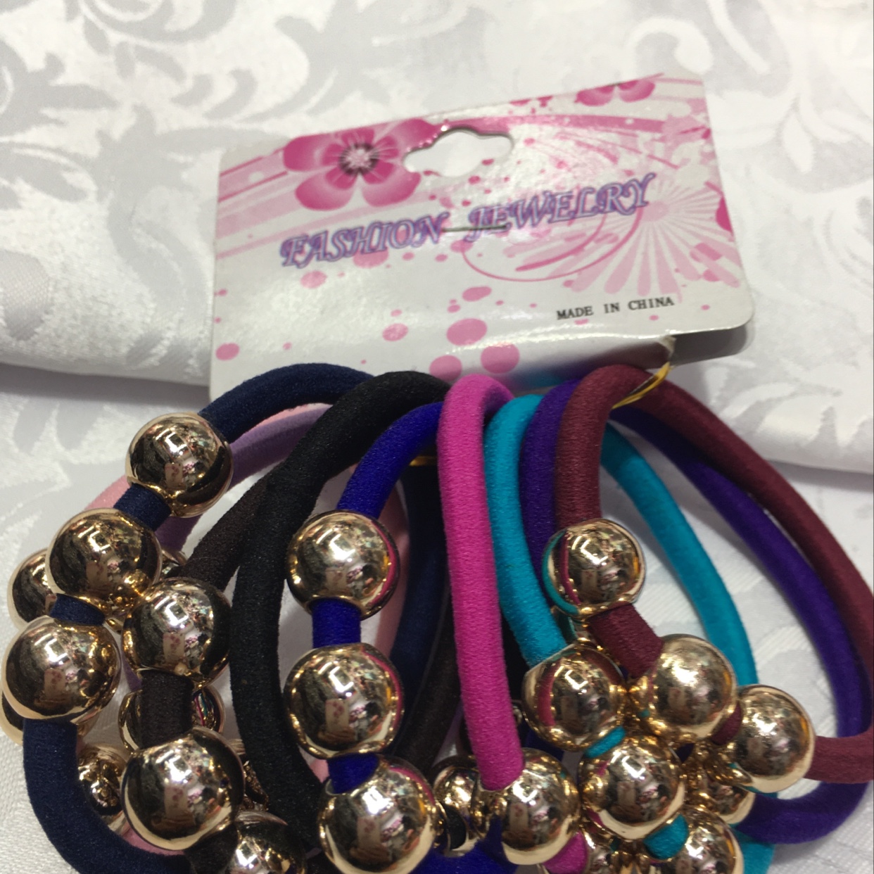 Ten rubber bands with two electric beads thumbnail