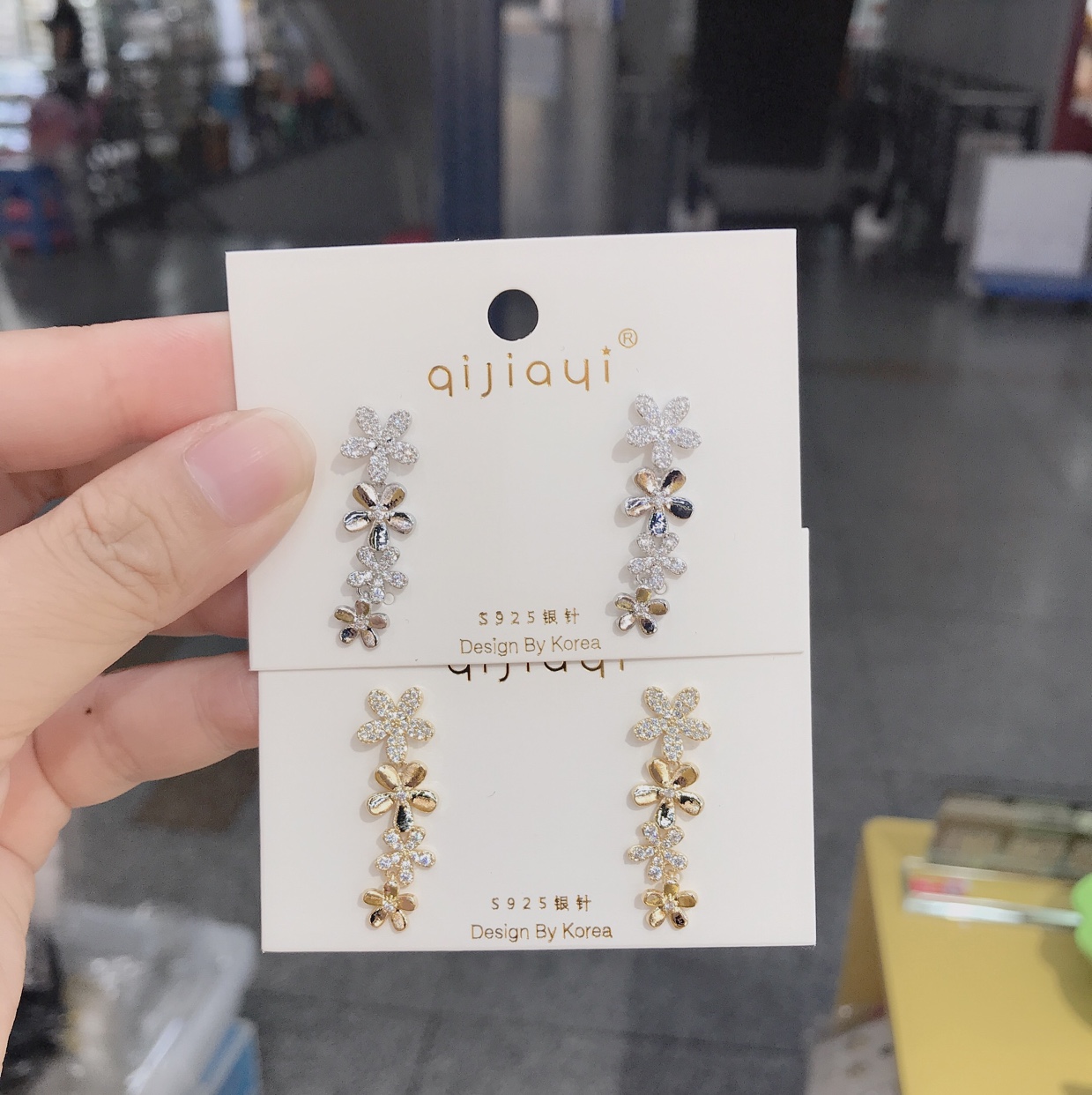 A white stone with four little earrings