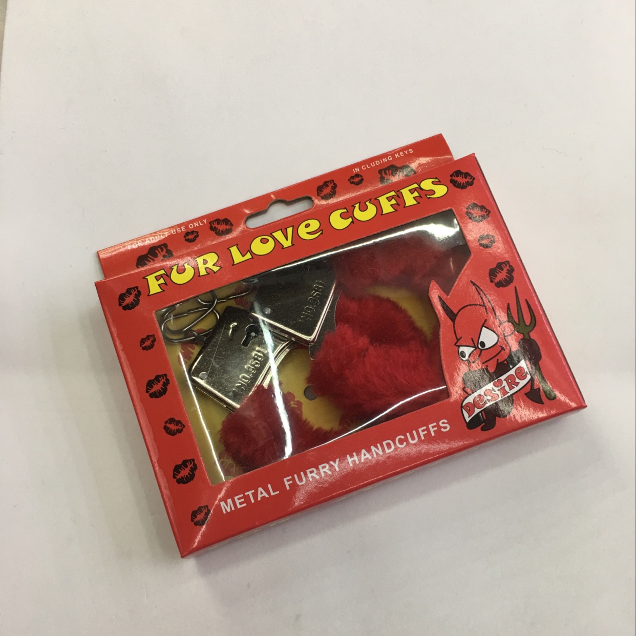 The box is red with plush handcuffs thumbnail