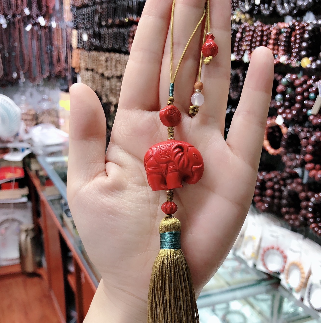 Hand-woven cinnabar auspicious elephant pendant
