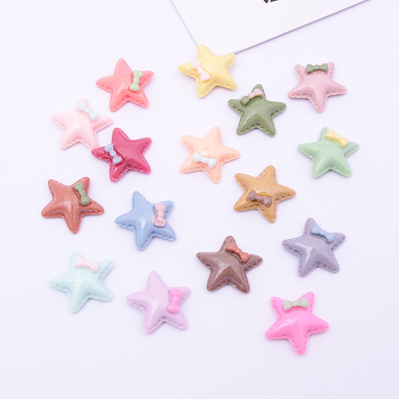 Assorted resin star appliques in various colors and finishes
