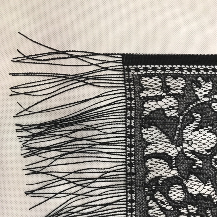 Close-up view of handmade lace texture showing detailed craftsmanship