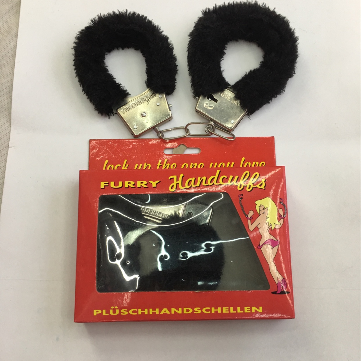 The box is black with plush handcuffs thumbnail
