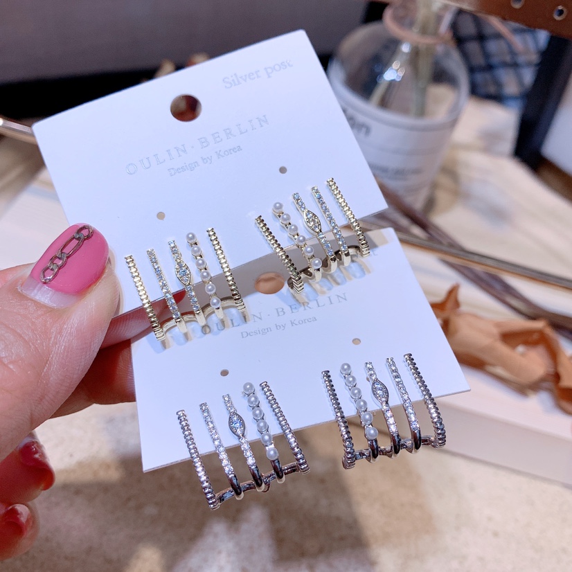 Multi - clawed character earrings