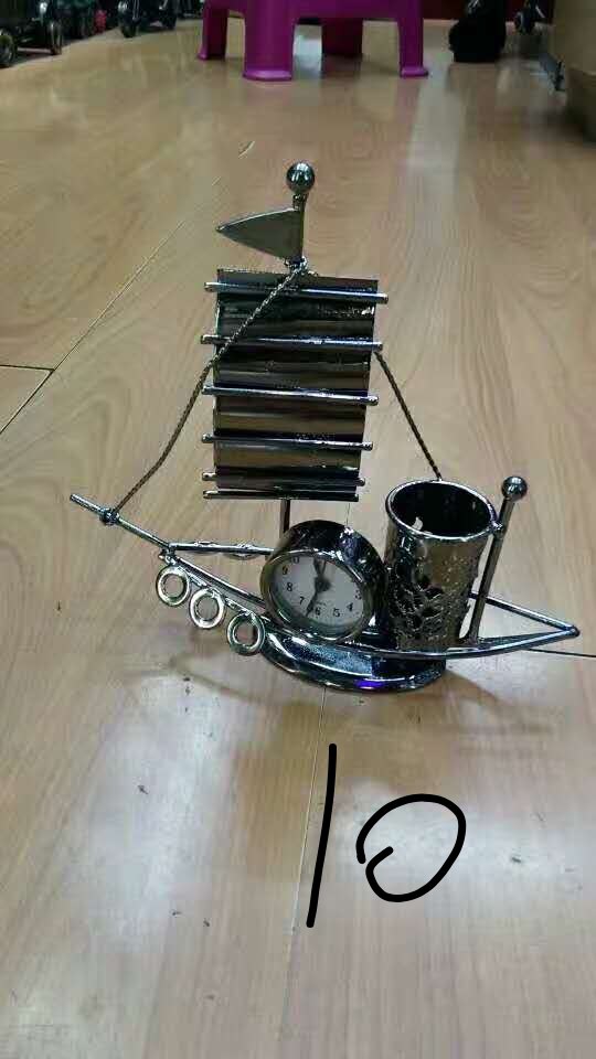 Wrought iron sailing clock