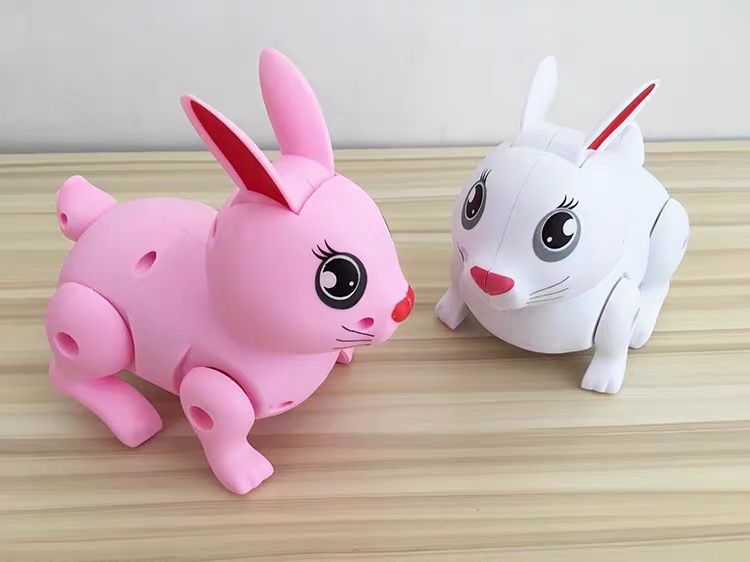 Electric simulation of pet jumping rabbit baby toys children can run will jump strip light music ears moving