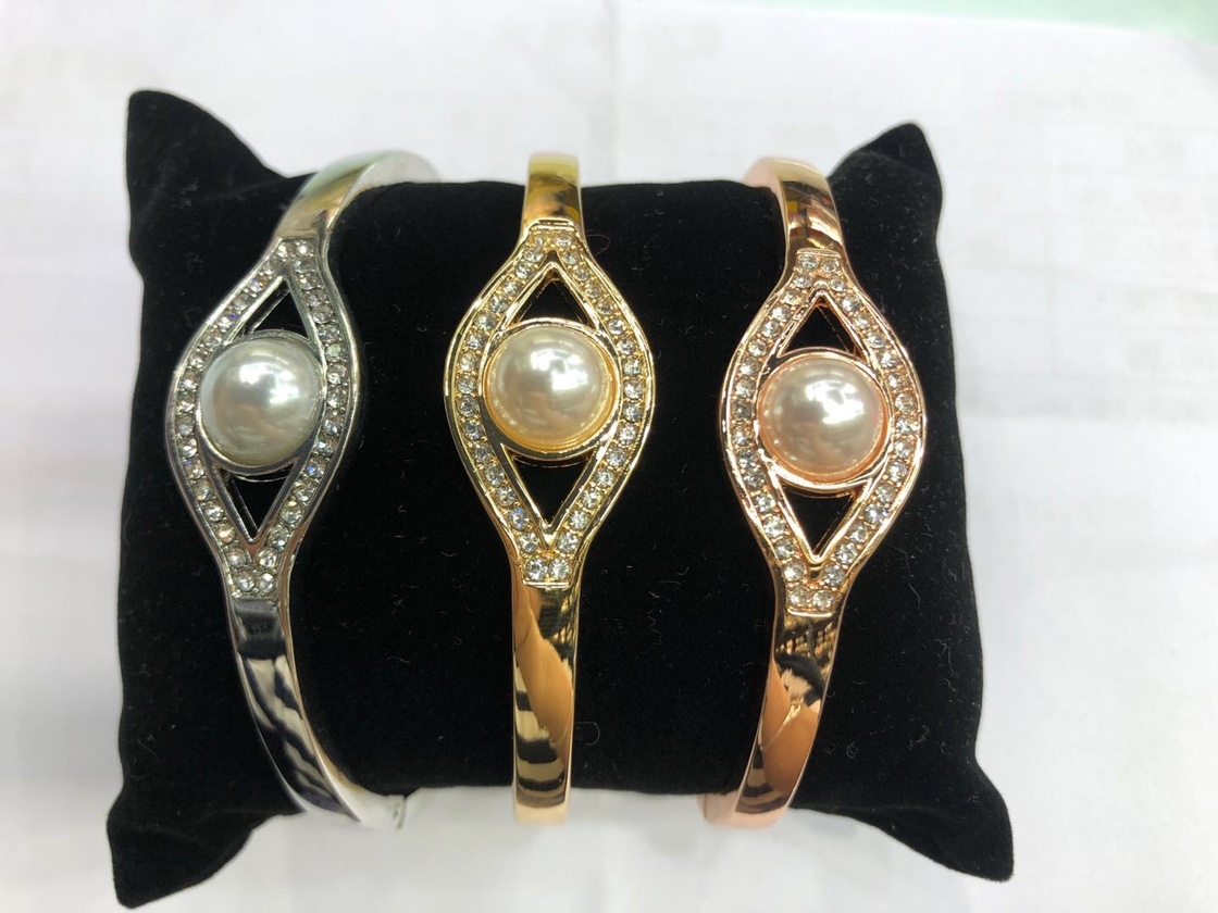 With the pearl bracelet thumbnail