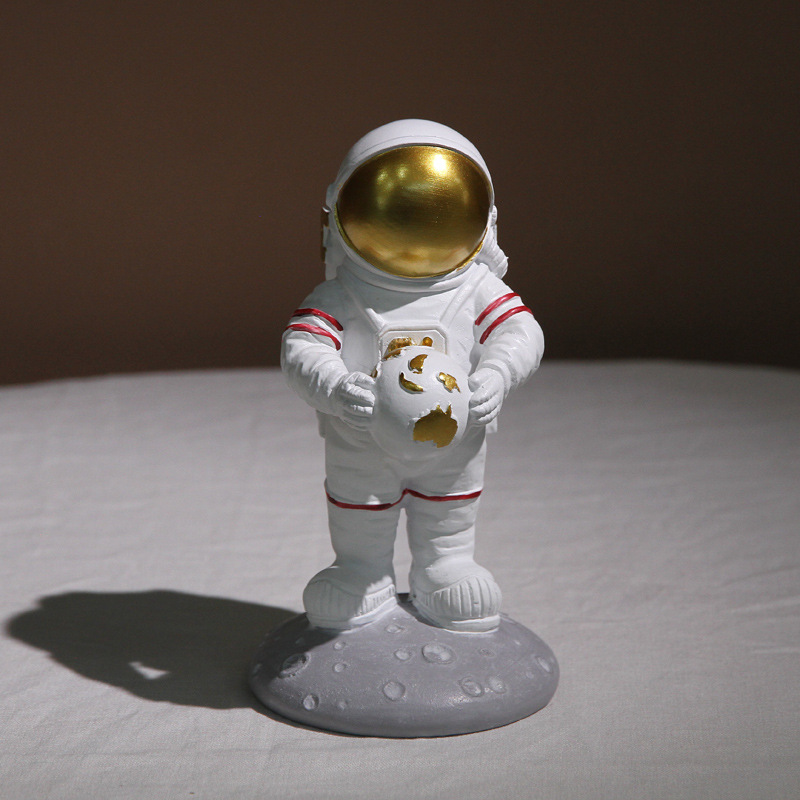 Creative astronaut holding the Earth figurine, Nordic cartoon astronaut resin handicraft, the Wandering Earth desktop decoration and display Specification image