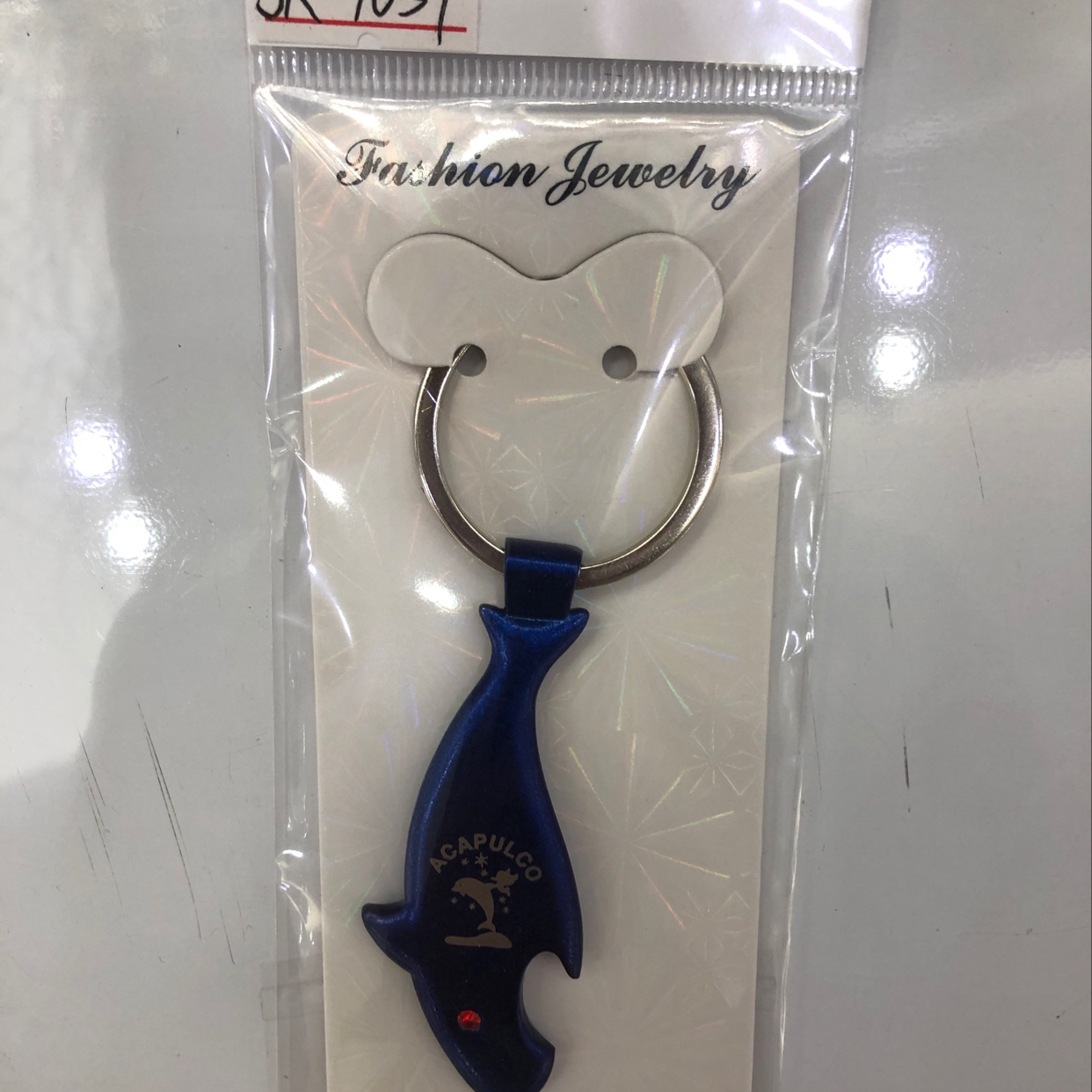 Spray painted blue shark key chain thumbnail