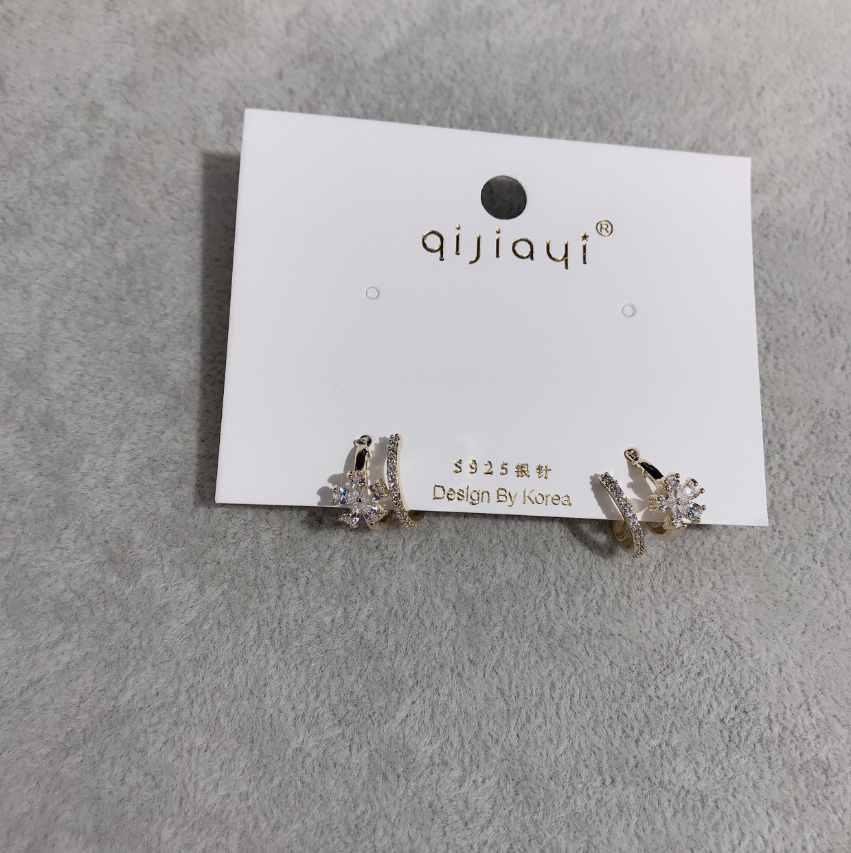 White stone floret with two ear studs thumbnail