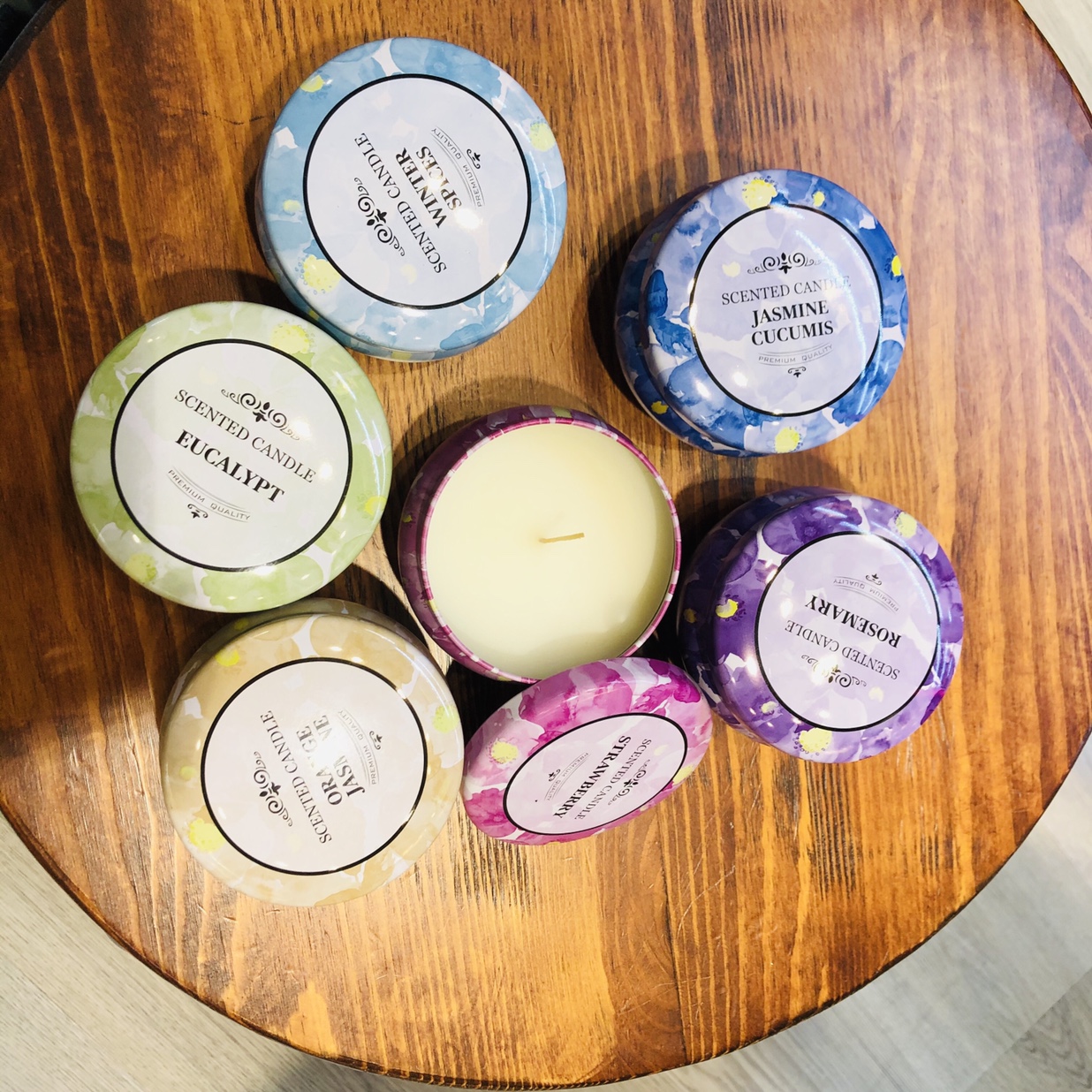 Scented candles in colored jars of scented oil wax