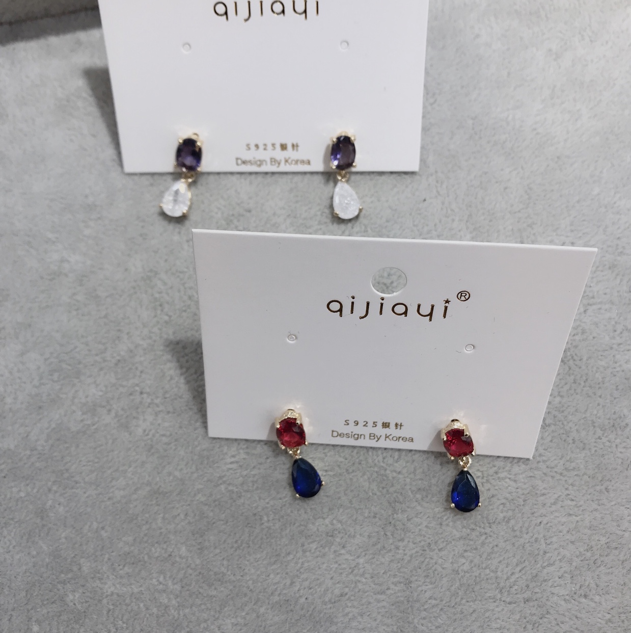 Water droplets clash with white stone earrings