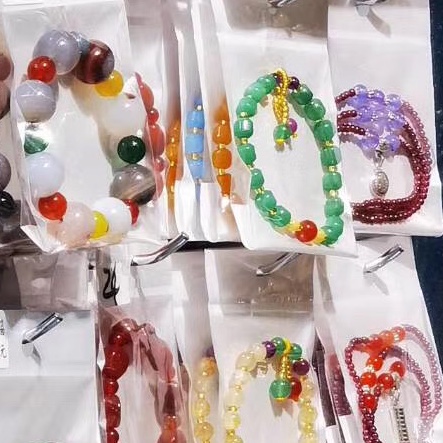 A mixed collection of 50 pendant bracelets details Picture
