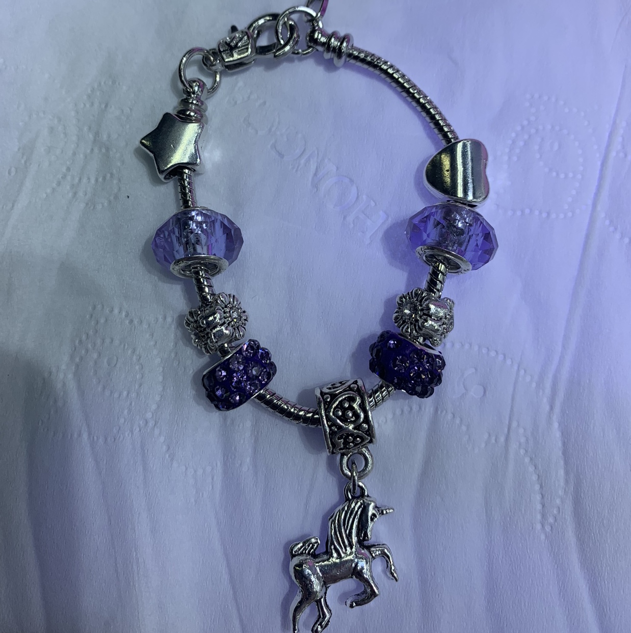 Pendona bracelet. full figure