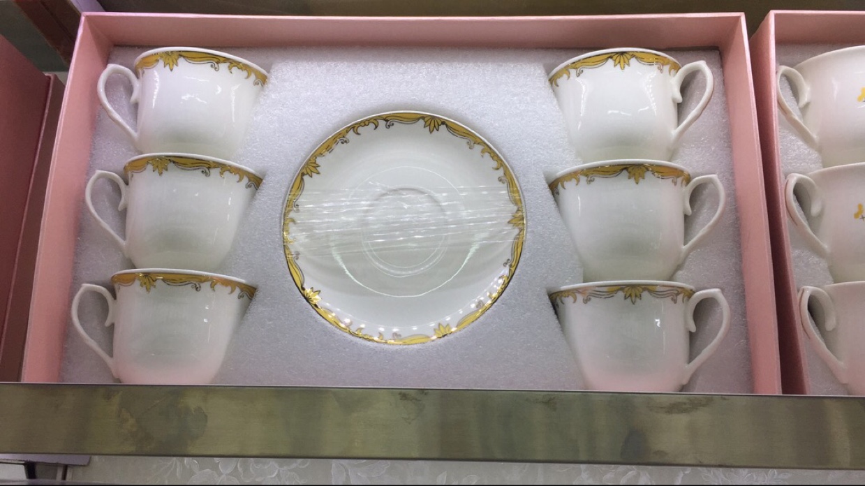 Gold rimmed cup and saucer thumbnail