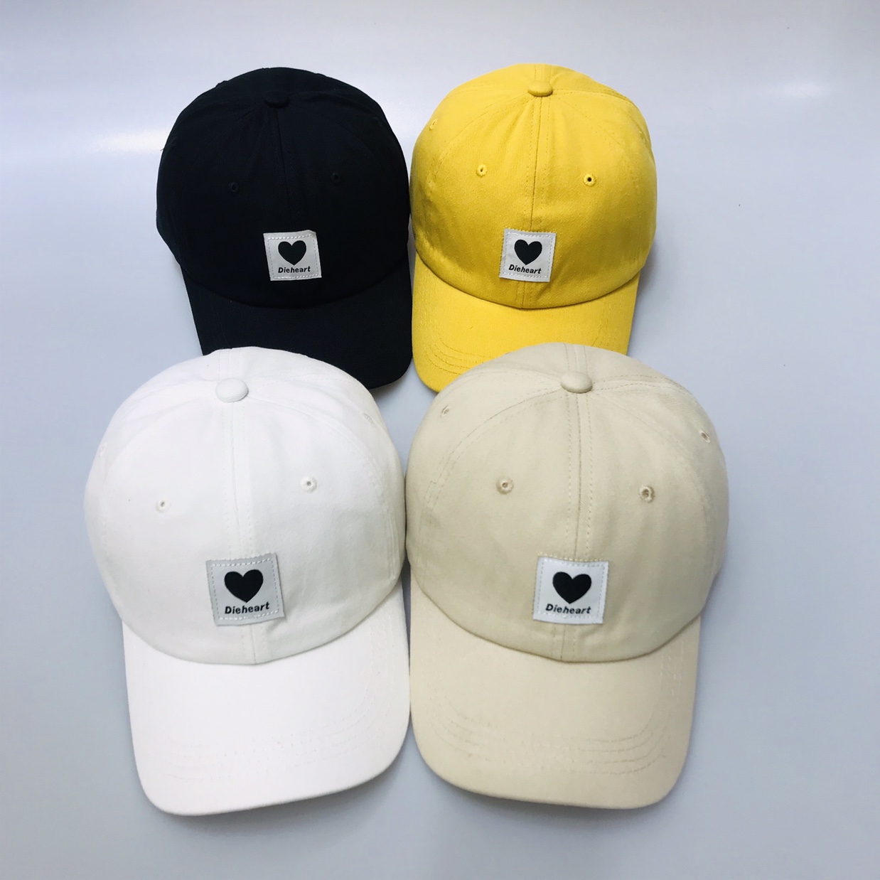 A baseball cap with a black heart thumbnail