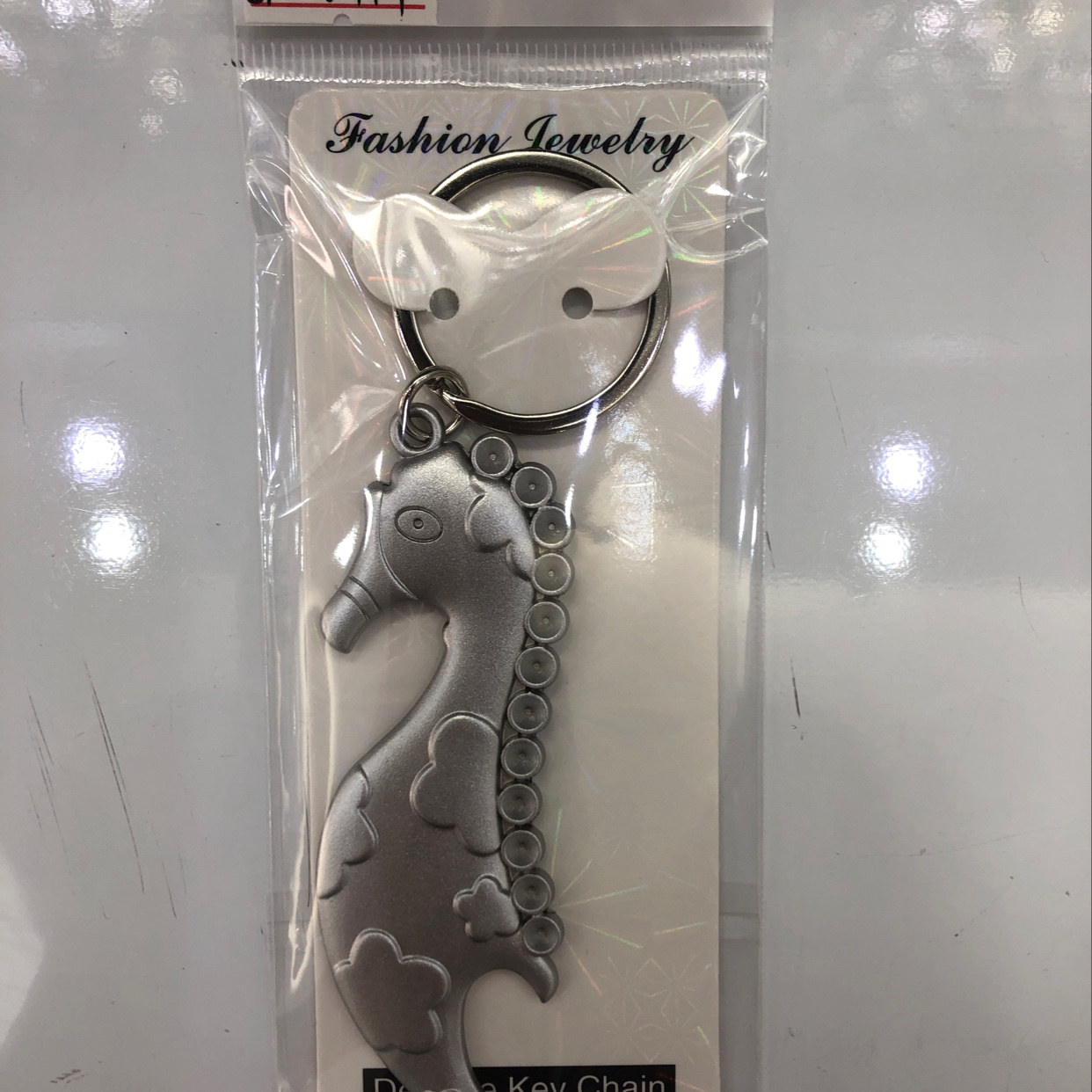 Spray-painted silver small seahorse keychain