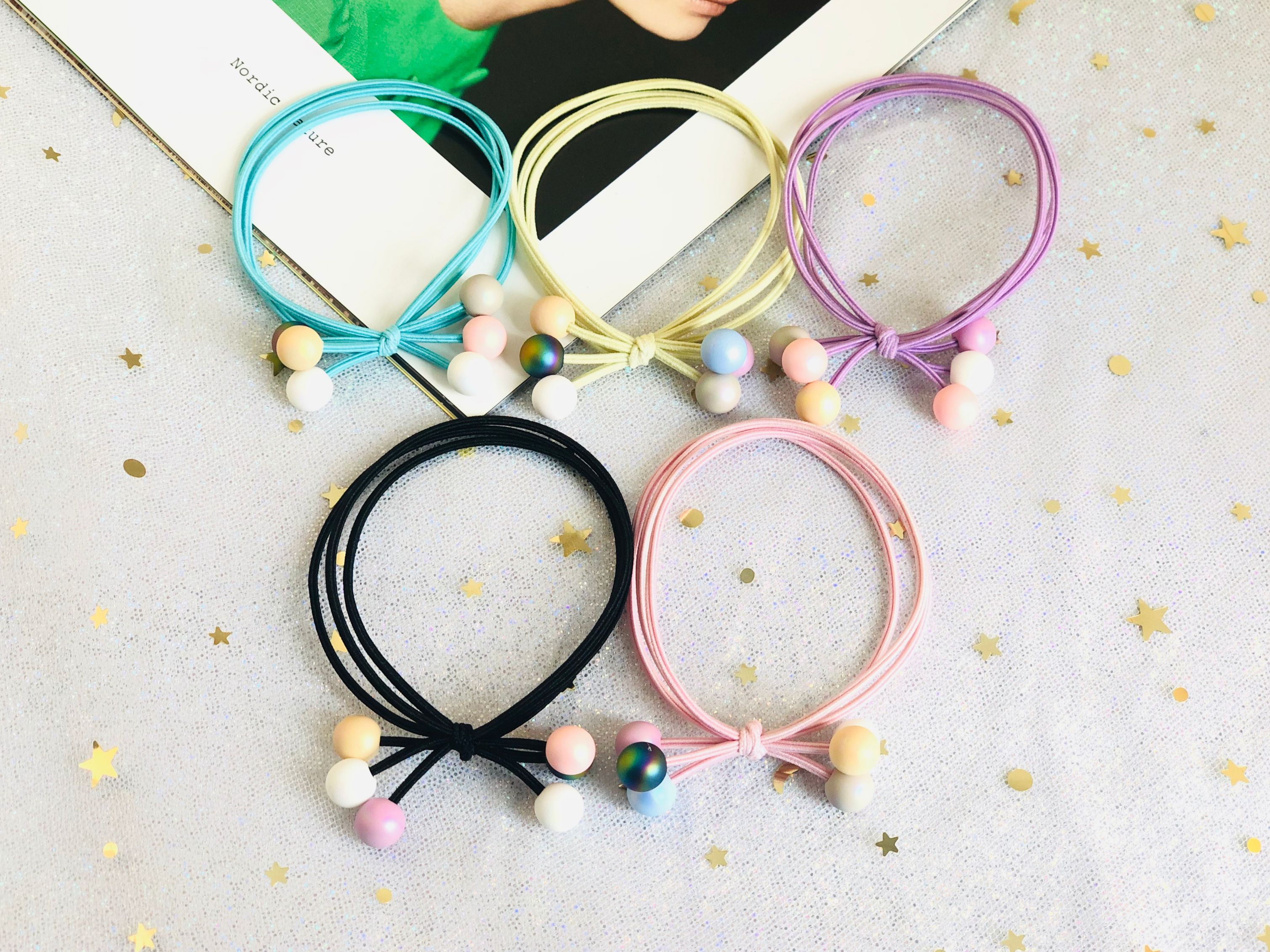 Knotted rubber bead three-strand nylon rubber band