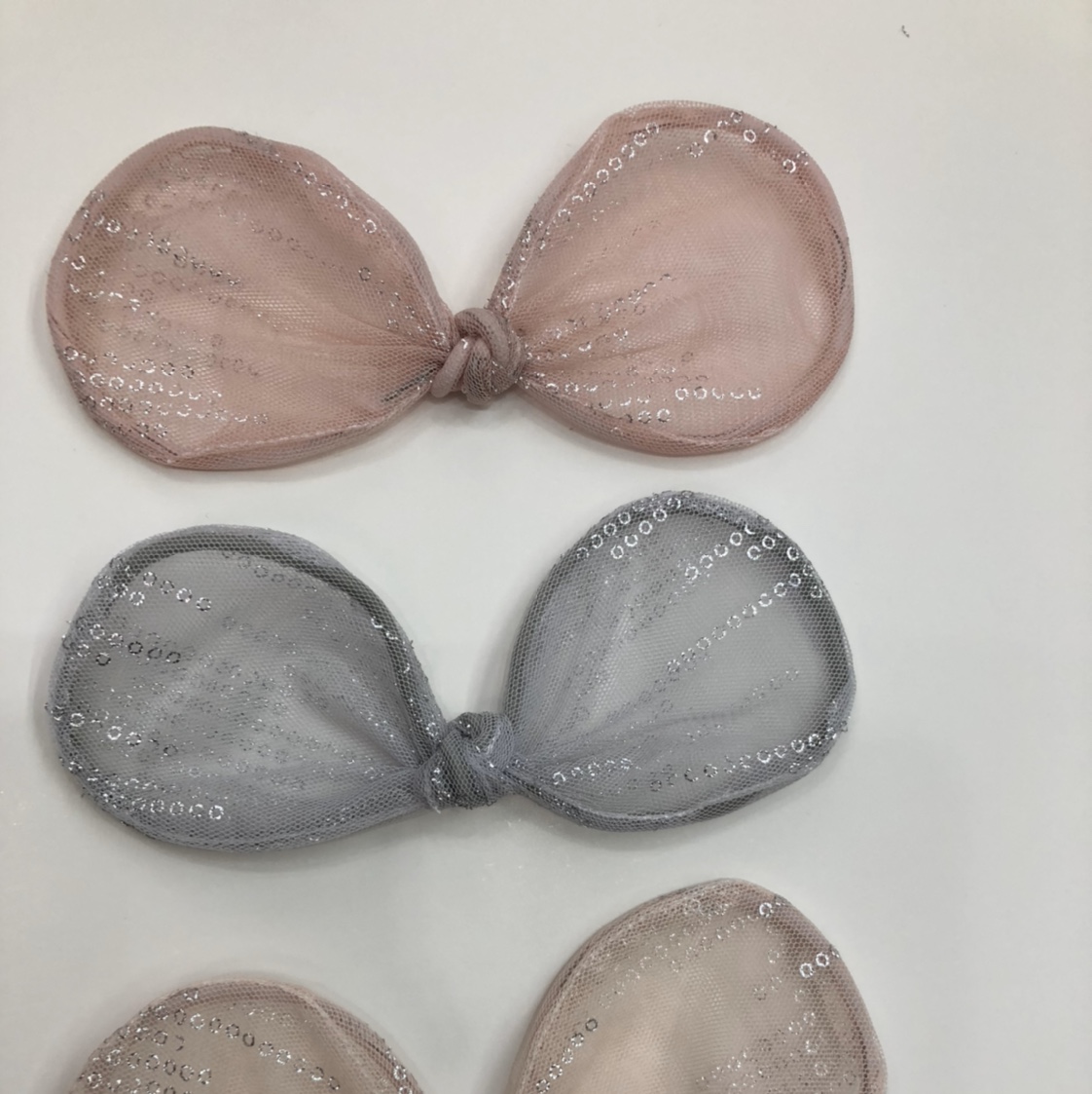 A bow tie shaped with mesh fabric and iron wire