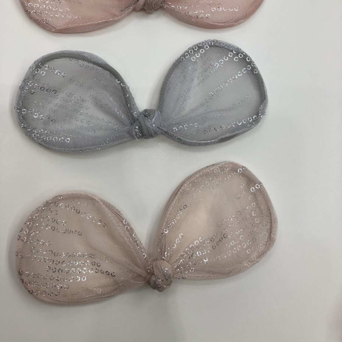 A bow tie shaped with mesh fabric and iron wire details Picture