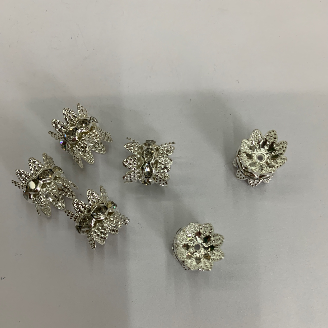 DIY handcrafted beaded, spacer, flower tray and diamond metal accessories details Picture