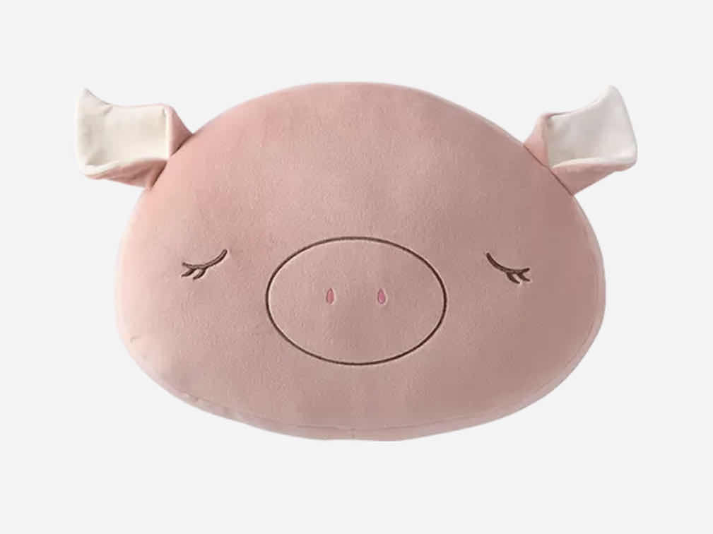 The home pig's waist leans against the pillow detail image 1