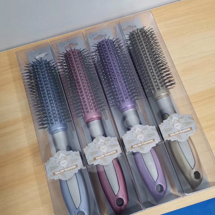 A variety of different massage combs and curling wooden combs undefined