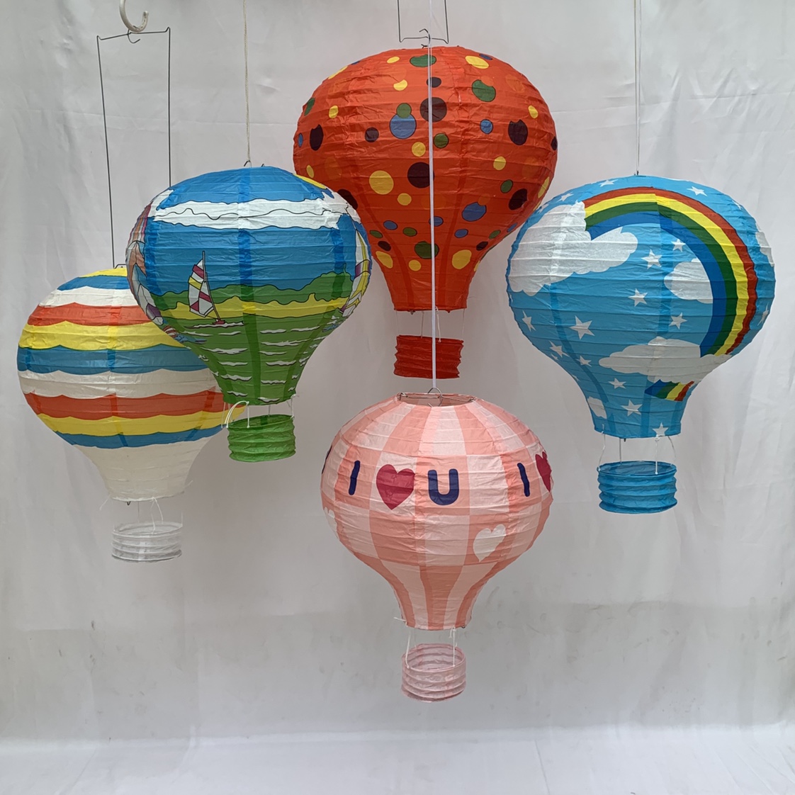 The festive wedding party is decorated with 12-inch hot air balloon lanterns thumbnail