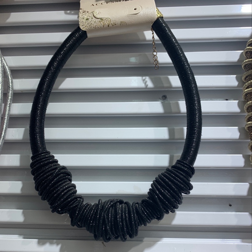 The necklace is black