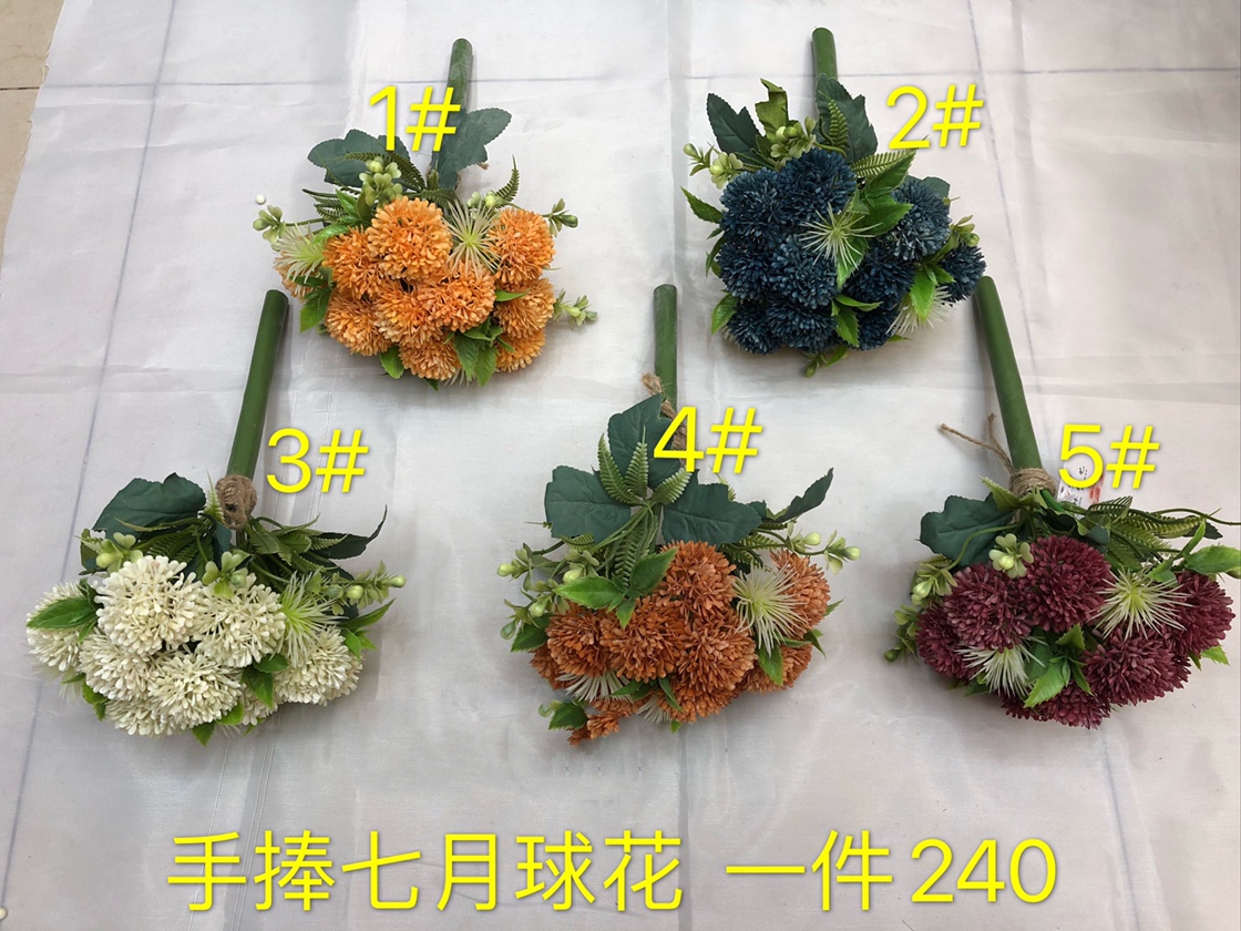 Holding July flower balls in hand