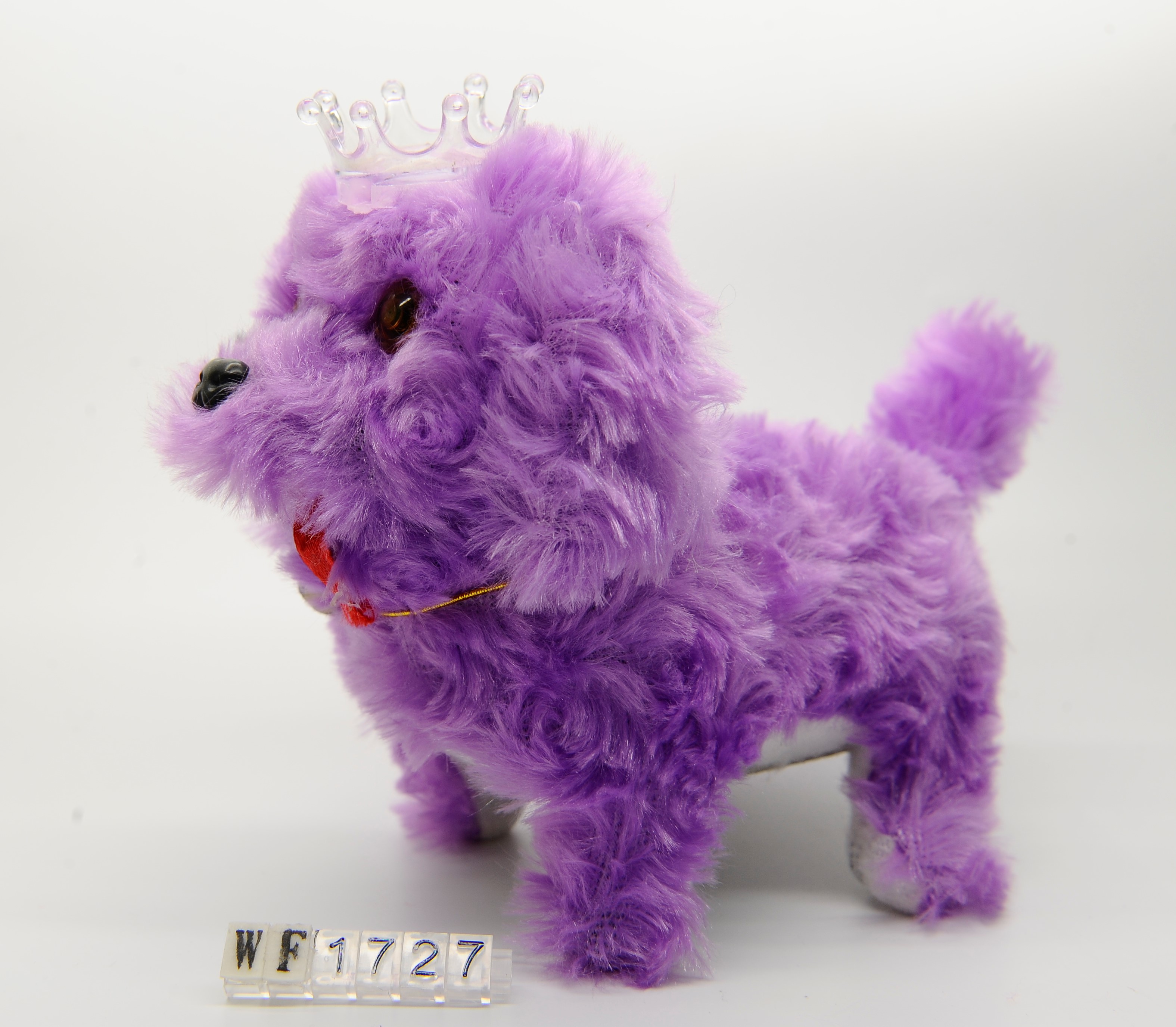 A stuffed toy dog on the floor in 2020 full figure