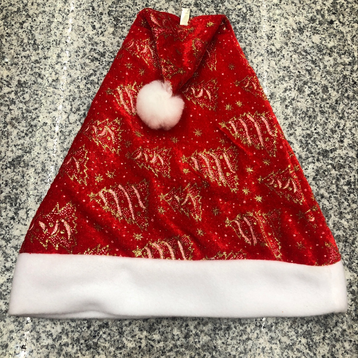 A woolen velvet Christmas hat with gold powder and fringed Christmas tree pattern details Picture