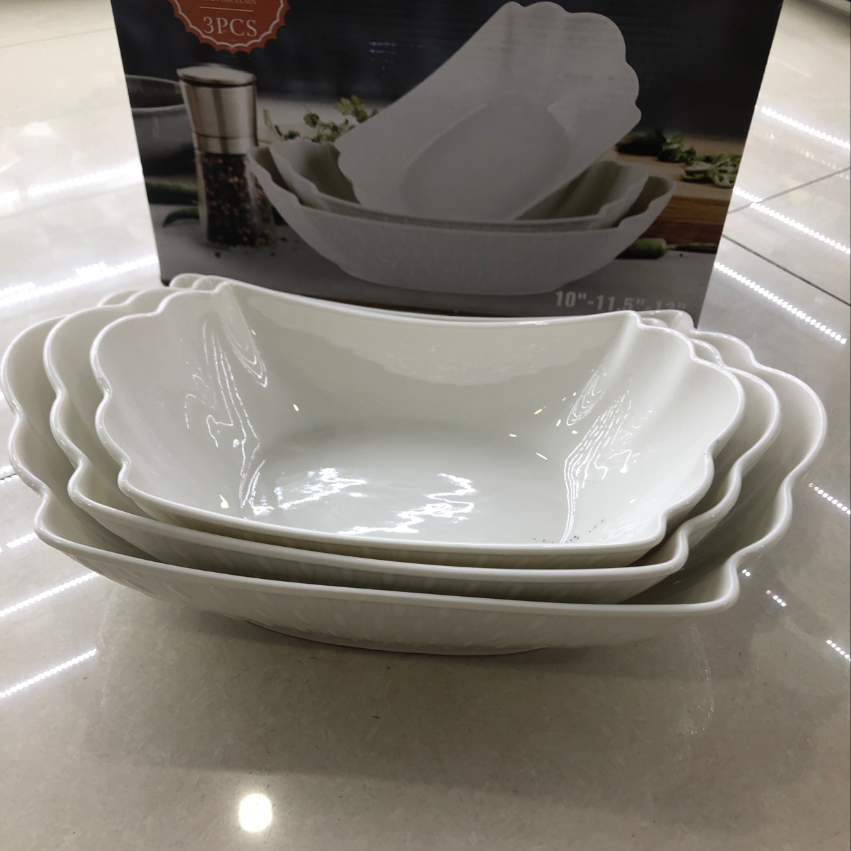 Three sets of 10-inch, 11.5-inch and 13-inch square bowls