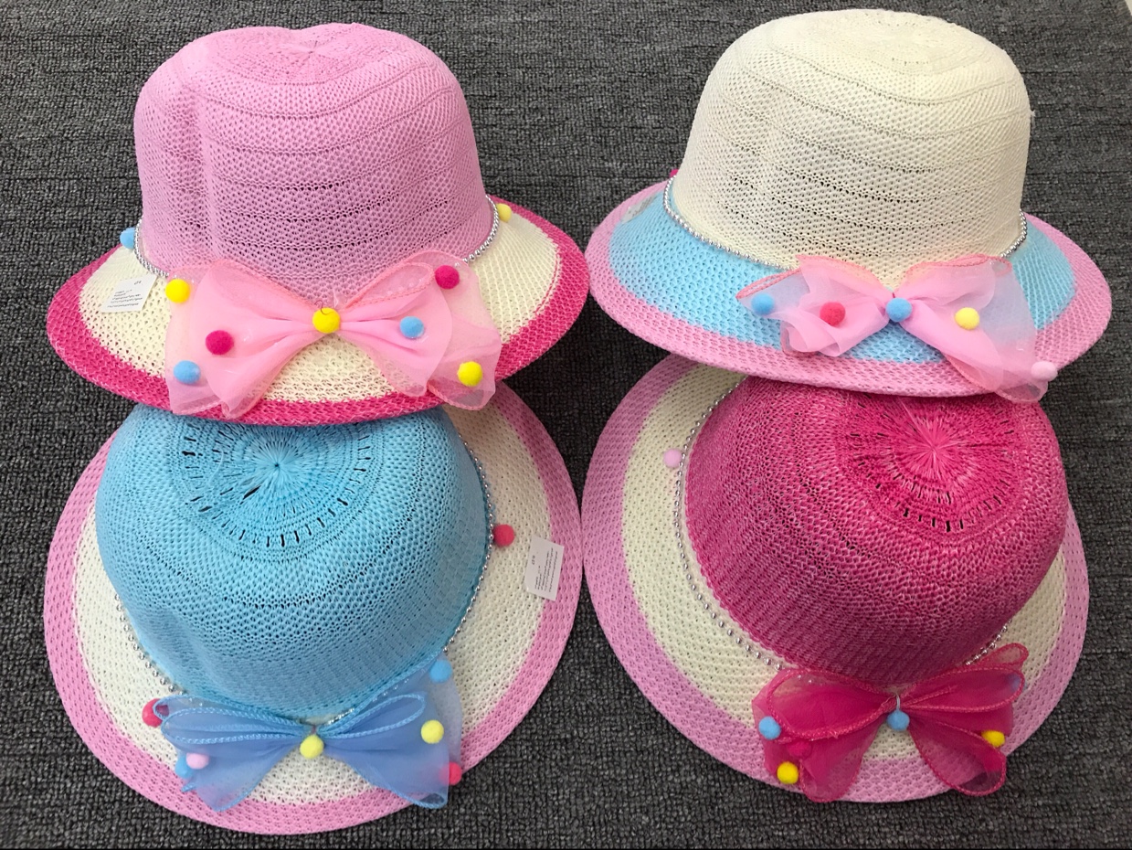 Foldable sun hat being packed into travel bag for easy storage